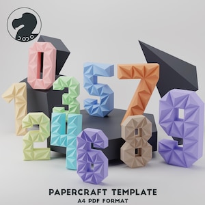 May include: A papercraft template featuring numbers 0 through 9, each made of colorful geometric shapes. The numbers are arranged in a semi-circle on a black surface. The template is for A4 PDF format.