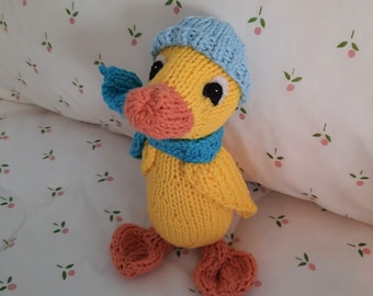 Organic cotton duckling, knitted in soft 100% organic cotton, wearing light blue beanie and turquoise blue scarf, made in USA