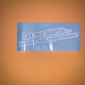 Puede incluir: Una pegatina azul con texto blanco que dice "Let me guess... license and registration?"