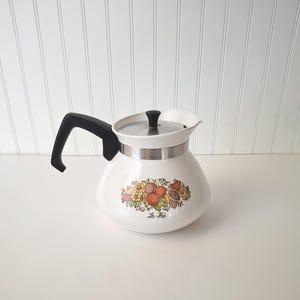 May include: A set of three ceramic mugs with a speckled, matte finish. The mugs are in shades of cream, light gray, and dark gray. Each mug has a simple, minimalist design, perfect for coffee or tea.