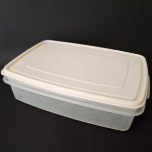 May include: A set of three ceramic mugs with a speckled, matte finish. The mugs are in shades of cream, light brown, and dark brown. Each mug has a rounded handle and a simple, modern design, perfect for coffee or tea.