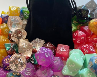 May include: A black velvet bag filled with a variety of colorful dice. The dice are made of clear plastic with glitter and have different numbers on each side.