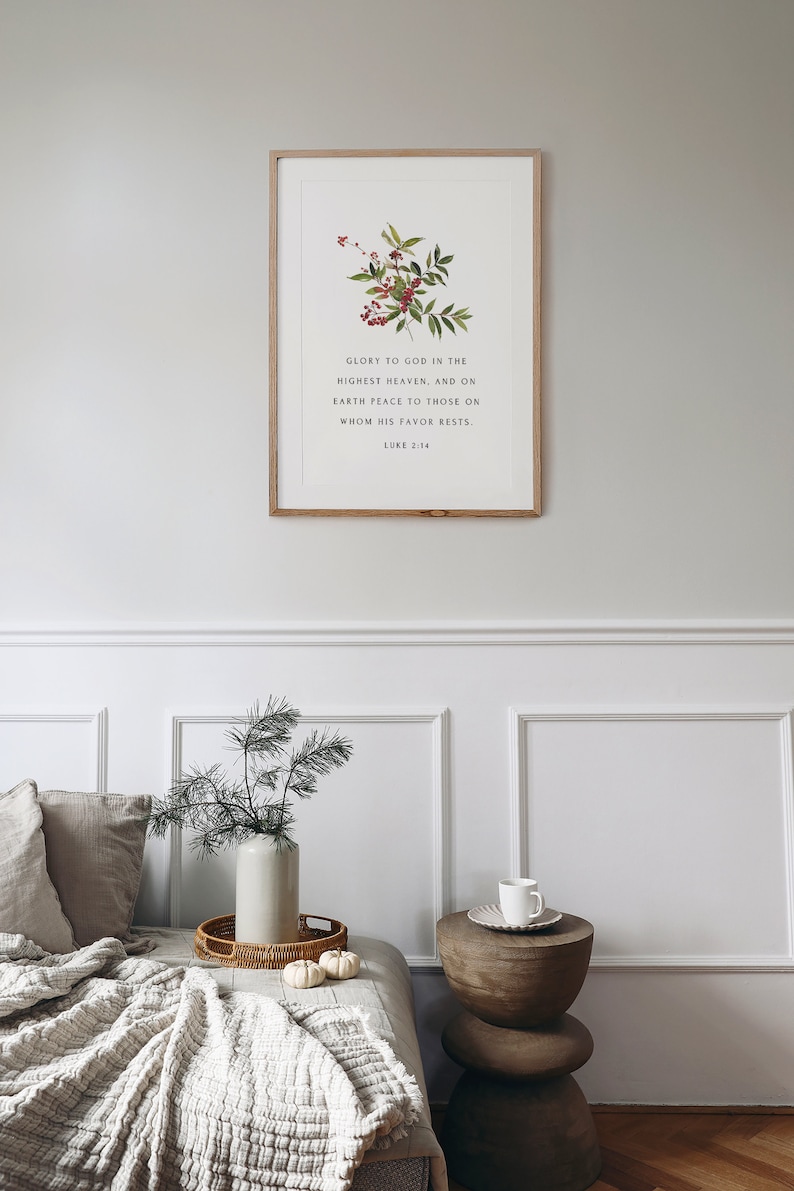 May include: A framed print with a floral illustration and a bible verse: "Glory to God in the highest heaven, and on earth peace to those on whom his favor rests. Luke 2:14"