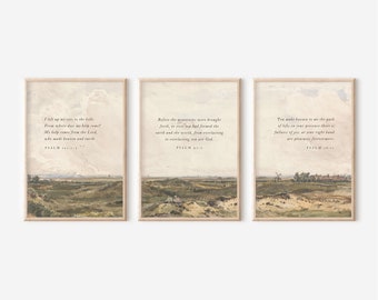 May include: Set of three framed art prints featuring landscape scenes with scripture verses. Each print has a light-colored frame and displays a different Psalm verse in elegant typography. The artwork combines pastoral imagery with religious text.