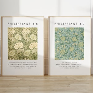 May include: Two framed art prints with floral patterns. The left print features a cream and green floral design, while the right print has a green and blue floral pattern. Each print has text at the top and bottom, including the book of Philippians.