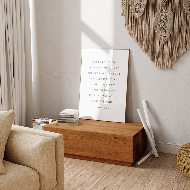 May include: A framed print with a white background and black text. The text reads: "Trust in the Lord with all your heart and lean not on your own understanding: In all your ways submit to Him, and He will make your paths straight. Proverbs 3:5-6"