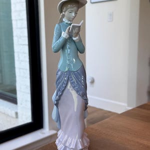 Retired Lladro Girl Reading a Book Figurine; Lladro Figurine