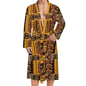 Peut inclure: Une robe à manches longues avec un motif jaune et noir et une ceinture.