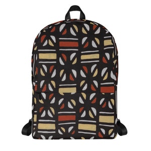 May include: Black backpack with a geometric pattern in shades of red, white, and yellow. The pattern is made up of circles, squares, and rectangles.
