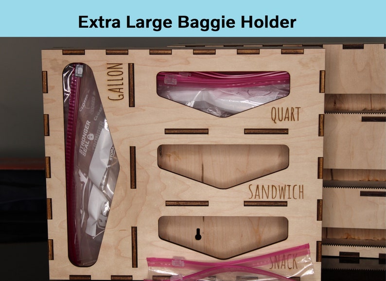 May include: Wooden organizer with four compartments for storing plastic bags. The compartments are labeled "Gallon", "Quart", "Sandwich", and "Snack".