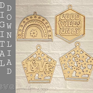 May include: Four wooden ornaments with different designs. The first ornament is a rainbow with a flower in the center. The second ornament is a hexagon with the text "GOOD VIBES ONLY". The third ornament is a pentagon with the word "LOVE" in the center. The fourth ornament is a pentagon with a floral design.