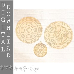 May include: Three wooden tree slice ornaments with concentric rings. The largest slice is approximately 6 inches in diameter, the middle slice is approximately 4 inches in diameter, and the smallest slice is approximately 2 inches in diameter. Harvest Grace Designs is written in cursive at the bottom of the image.