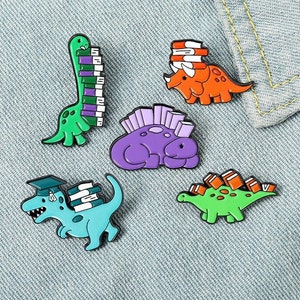 Dinosaur and Books Enamel Pin Custom Reading Habit Animal Brooch Bag Clothes Lapel Pin Badge Cartoon Jewelry for Kid Friend