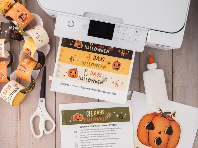 May include: Printable Halloween countdown chain with orange and black illustrations of pumpkins and spiders. The chain includes numbers 26, 27, 28, 30, 31, 4 days until Halloween, 5 days until Halloween, and 17 days until Halloween. The printable also includes instructions for assembling the chain.