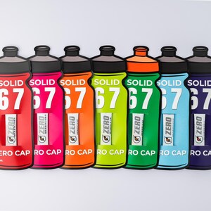 May include: Six vibrant water bottles in a row, in shades of red, pink, orange, green, blue, and purple. Each bottle features a black cap and the text "SOLID 67" and "ZERO CAP RO CAP". The design is sporty and eye-catching.