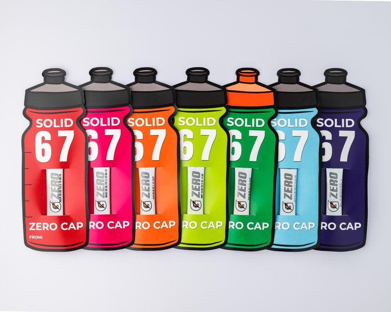 May include: Six vibrant water bottles in a row, in shades of red, pink, orange, green, blue, and purple. Each bottle features a black cap and the text "SOLID 67" and "ZERO CAP RO CAP". The design is sporty and eye-catching.