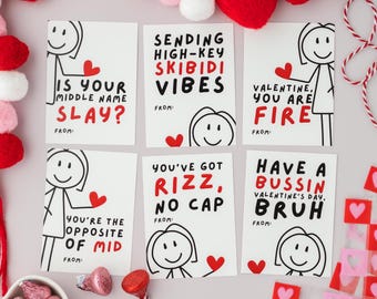 May include: Eight Valentine's Day cards with different funny messages and stick figure illustrations. The cards are white with red and black text. The messages include "Is your middle name slay?", "Sending high-key skibidi vibes", "Valentine, you are fire", "You're the opposite of mid", "You've got rizz, no cap", and "Have a bussin Valentine's Day, bruh".