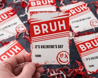 May include: A red and white Valentine's Day card with the text "BRUH" and "It's Valentine's Day" with a space for a name under "From:".