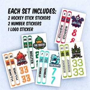 May include: A set of hockey stick, number, and logo stickers. The stickers feature various hockey team logos, including the Ducks, the Spartans, the Hocbears, and the Master. The stickers are in various colors, including green, orange, red, and blue.