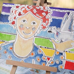 Aquarell-Postkarte „Bunte Dame mit Taube“