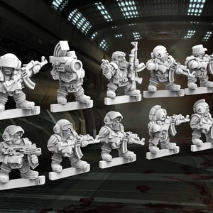 May include: A collection of miniature figurines of armored soldiers, each holding a rifle. The figures are in various poses, standing on rectangular bases. The overall color scheme is a light gray, with details suggesting military gear.