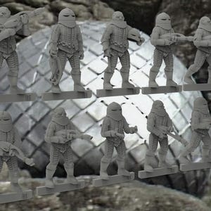 May include: A collection of gray miniature figures of soldiers in futuristic armor, each holding a weapon. The figures are standing on rectangular bases, with a textured background of a metallic sphere and rock formations.