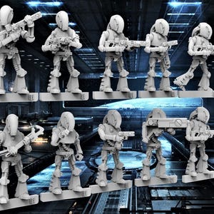 May include: Ten gray plastic miniature figures of robots with different weapons, standing on white bases. The robots have round heads with a visor and a body with articulated limbs.