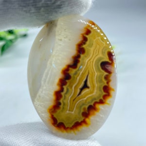 May include: A rustic wooden sign with the text "Welcome to our home" in white lettering. The sign has a distressed finish and a simple, inviting design, suitable for a front porch or entryway.