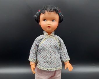 Vintage Chinese plastic doll, jointed wrists