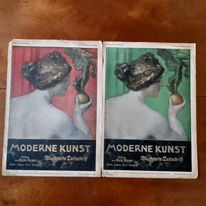 May include: Two vintage magazine covers featuring a woman with a hat and a winged figure holding a sphere. The covers are titled "Moderne Kunst" and feature the text "Verlag von Rich. Bong Illustrierte Zeitschrift".