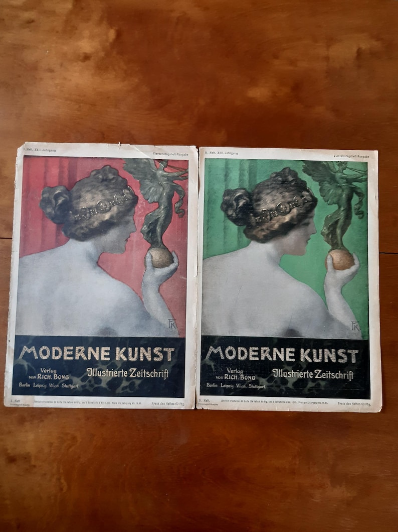 May include: Two vintage magazine covers featuring a woman with a hat and a winged figure holding a sphere. The covers are titled "Moderne Kunst" and feature the text "Verlag von Rich. Bong Illustrierte Zeitschrift".