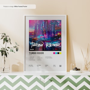 May include: A white framed poster with a colorful illustration of a futuristic city and a car. The poster has the title "Turbo Rider" and the artist's name "BAZZK". The poster also includes the album's tracklist, release date, recording date, length, and a QR code to scan and play.