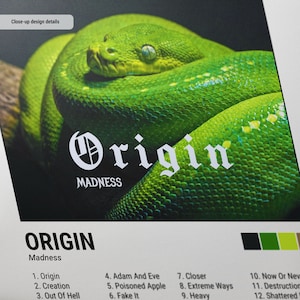 May include: A close-up of a green snake with the word "Origin" in white text above it. The text "Madness" is below the word "Origin". The image is a design detail for a product.