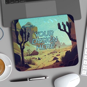 May include: A desert landscape mousepad with a blue sky and brown rocks. The text "YOUR DESIGN HERE" is written in blue on the mousepad.
