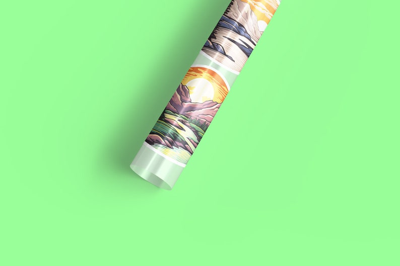 May include: A roll of wrapping paper with a repeating pattern of colourful mountain landscapes. The paper is rolled up and the end is visible, showing the design.