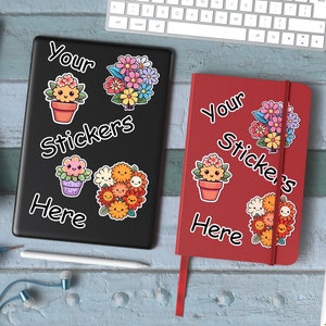 May include: Two black and red notebooks with the text "Your Stickers Here" on them. Each notebook has a variety of colorful flower stickers with happy faces on them.