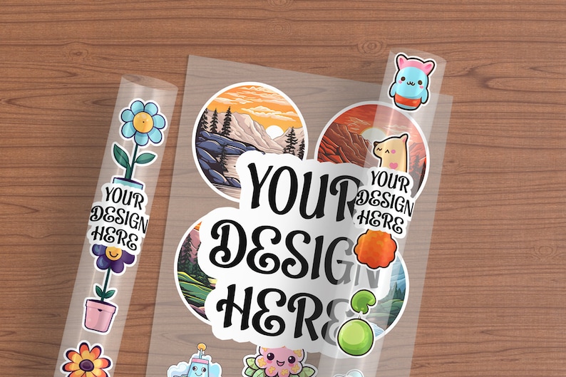 May include: A sheet of clear sticker paper with various designs. The stickers include a mountain scene, a llama, a flower, a cartoon character, and a green orb. The text "YOUR DESIGN HERE" is printed on the sticker paper.