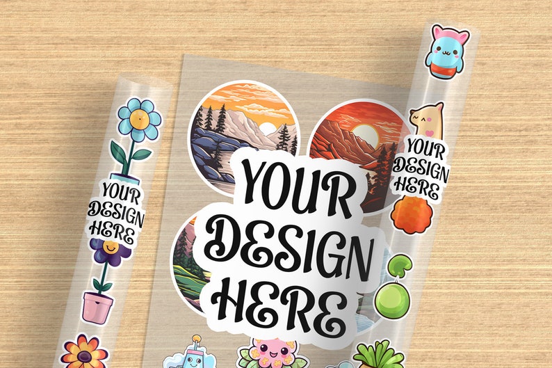 May include: A sheet of clear sticker paper with various designs, including a mountain landscape, a flower, a cartoon character, and the text "YOUR DESIGN HERE".