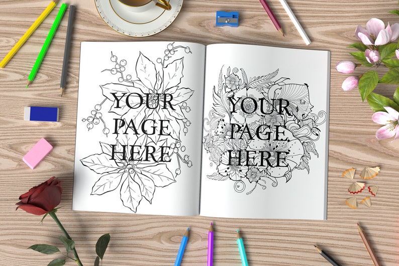 May include: An open coloring book with two pages featuring intricate black and white illustrations of flowers and foliage. The text "YOUR PAGE HERE" is written on each page. The book is surrounded by pencils, erasers, and other art supplies.