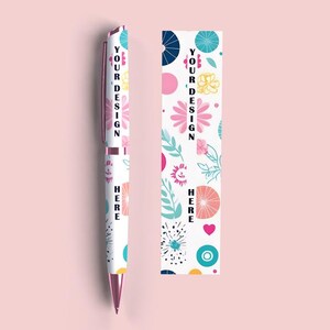 May include: A white pen with a floral design and the text "YOUR DESIGN HERE" printed on it.