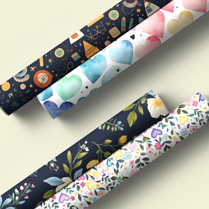 May include: Four rolls of wrapping paper with different patterns. The first roll has a dark blue background with colorful illustrations of various objects. The second roll has a white background with blue, green, and pink watercolor hearts. The third roll has a dark blue background with green leaves and white flowers. The fourth roll has a white background with colorful flowers and hearts.