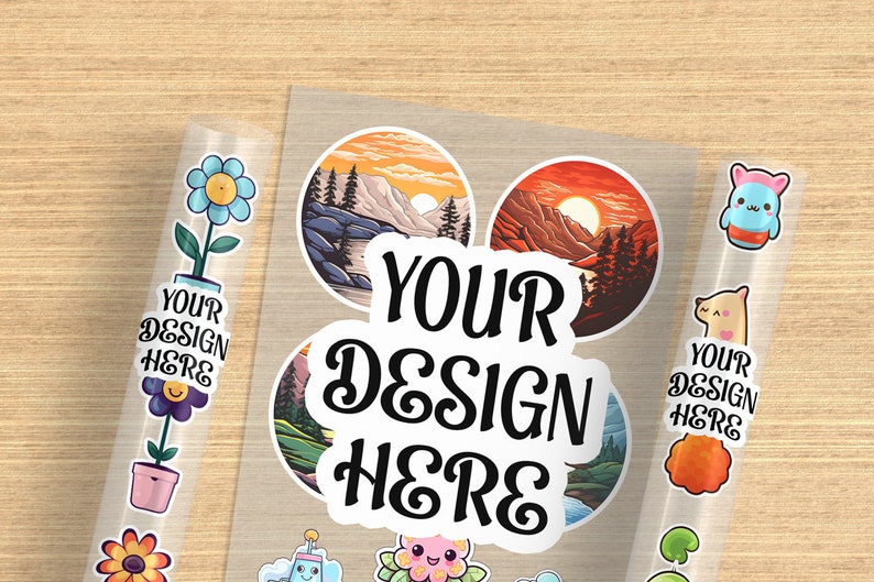 May include: A sheet of clear sticker paper with various designs. The designs include a flower, a mountain landscape, a sunset, a cartoon animal, and a text sticker that says "YOUR DESIGN HERE".