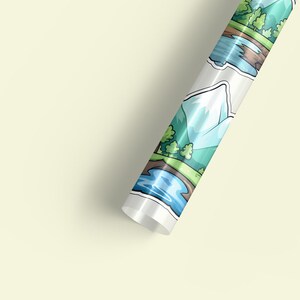 May include: A roll of wrapping paper featuring a repeating pattern of cartoon mountains, trees, and rivers. The paper is white with a glossy finish.