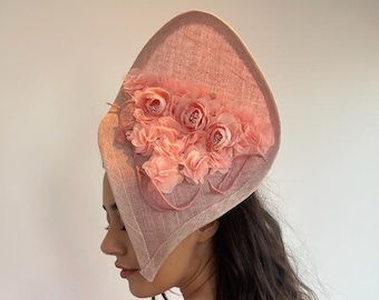 Pink Freeform Sculptural Hat with Satin Flowers and Handmade Sinamay Leaves. The perfect pink wedding hat, ascot hat or derby hat.