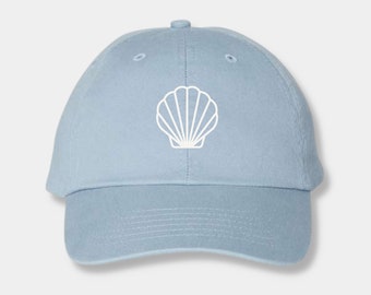 May include: A light blue baseball cap with a white outline of a seashell on the front.