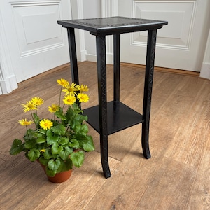 May include: A set of three ceramic mugs with a speckled, matte finish in cream, light grey, and dark grey. Each mug has a simple, minimalist design, suitable for coffee or tea.