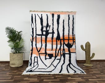 Alfombra Beni Ourain naranja hecha a mano, de lana, con diseño bereber abstracto.