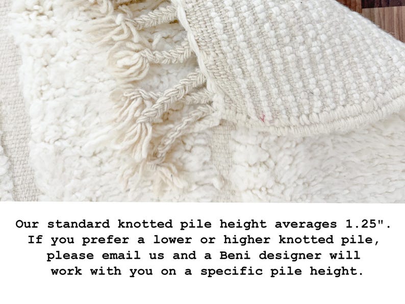 May include: Close-up of a cream-colored rug with a textured, knotted pile and fringe detailing. The rug's pile height averages 1.25 inches. The rug has a soft, inviting appearance, suitable for home decor.