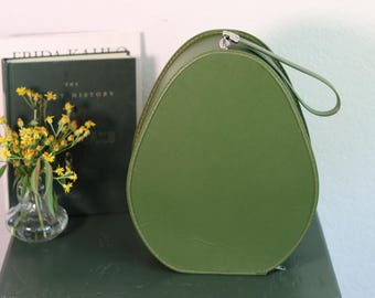Sac de transport rétro années 60 en vinyle vert avocat en forme d'oeuf avec poignée sur le dessus