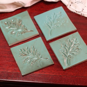 Handmade Ceramic Teal Drink Coasters with Leaf Stamp Pattern | Set of 4